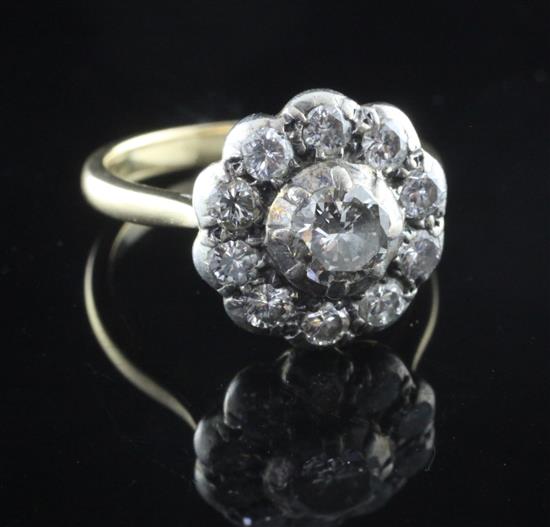 An 18ct gold, silver and diamond cluster ring, size L.